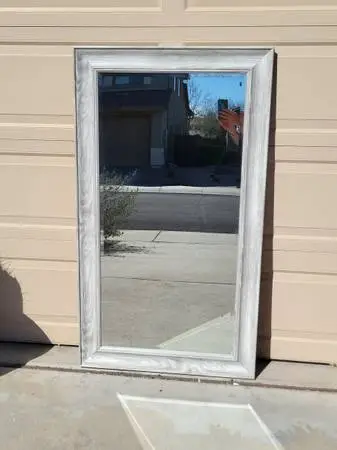 full-length rectangular floor mirror with a distressed gray wood