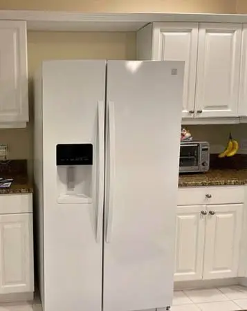 White fridge has ice and water dispenser