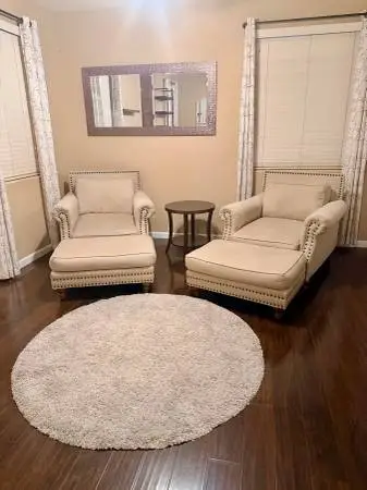 2 comfy nailhead sitting chairs/ottomans, mirror, carpet and table
