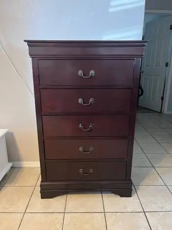 Tall dresser, solid wood, all the drawers works perfectly