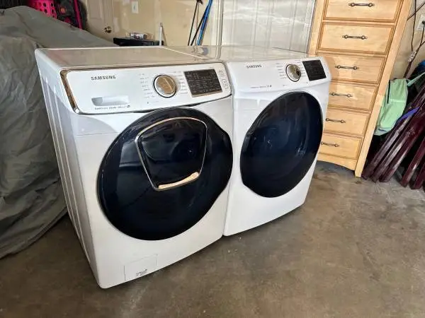 SAMSUNG front load steam washer and electric steam dryer for sale.