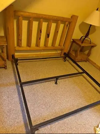 queen sized log headboard and adjustable steel bedframe