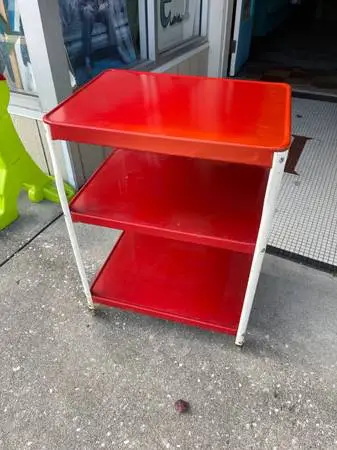 Vintage red metal roller cart