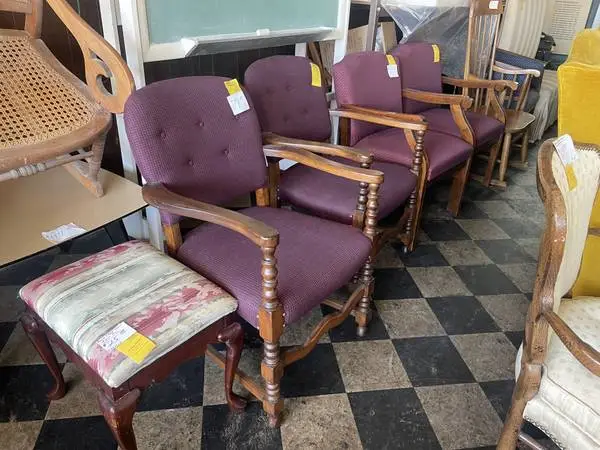 Sets of upholstered wooden arm chairs