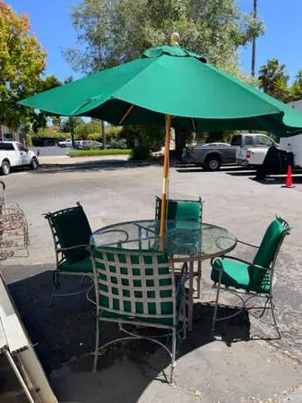 Iron glass top patio table