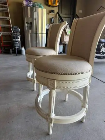 Two swiveling barstools