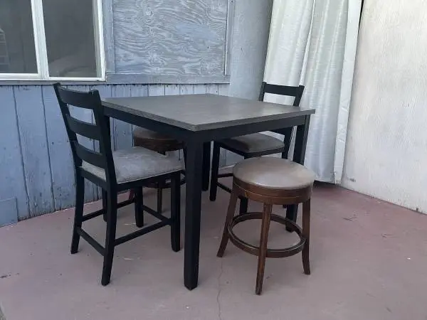 High dining table with two chairs and two bars stools in good conditio