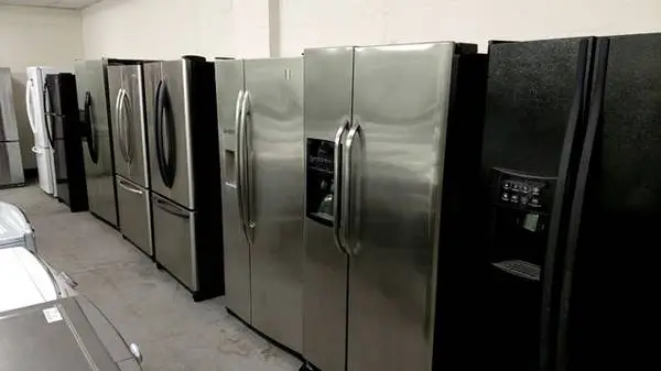 Side by side black and stainless steel refrigerator Units