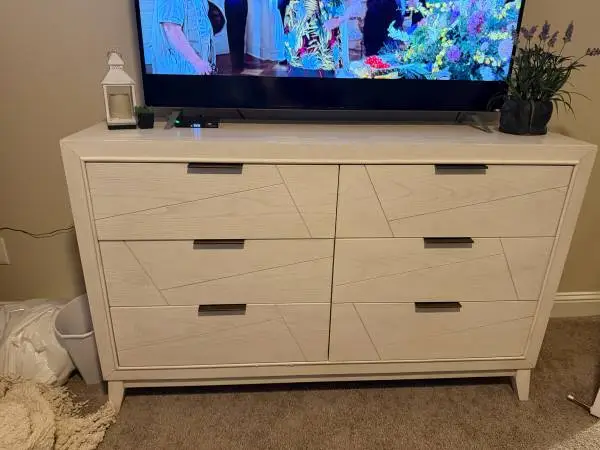 Dresser ( living spaces ) and 53 in TV