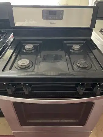 #### WHIRLPOOL STAINLESS BLACK STOVE WITH SELF CLEANING ##