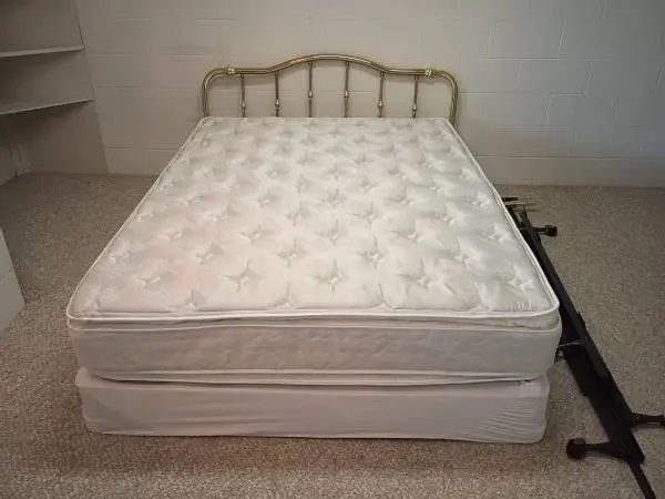 Queen size mattress and brass headboard