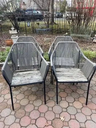 Set of four iron, rope and teak patio dining chairs