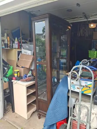 Large, lit, wood and glass display cabinet