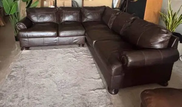 GENUINE LEATHER SECTIONAL BY ASHLEY FURNITURE, DELIVERY INCLUDED