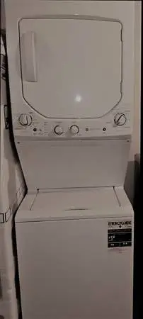 Almost new GE stacked washer-electric dryer 24 wide apartment size