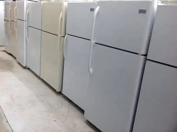 Top freezer style refrigerator