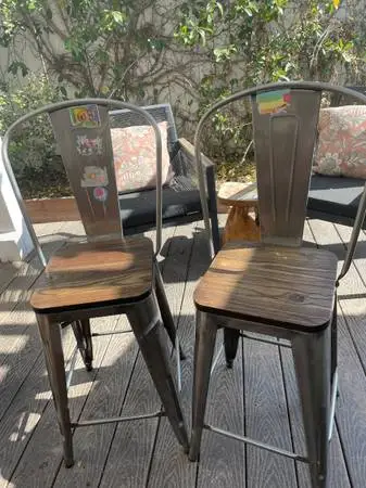 Pair of metal bar stools with wood seats