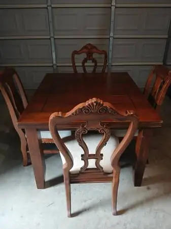 Nice real wood dining table with left and four chairs