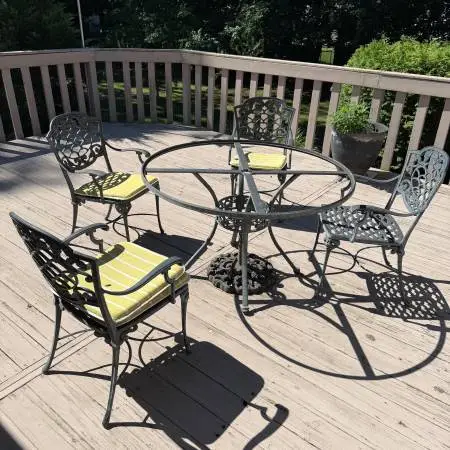 Cast steel glass topped 4 chair patio set with weighted umbrella