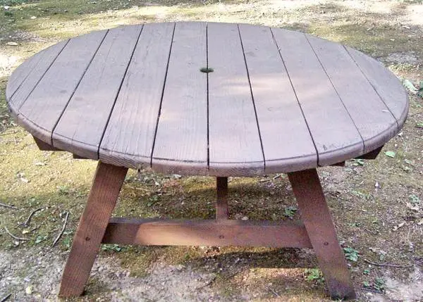 Solid Round Table Measures 54” Across  Top Has Thick 2” Boards