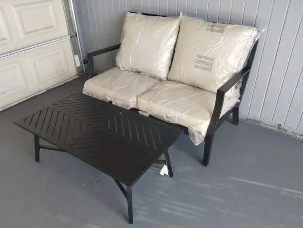 Outdoor patio loveseat with coffee table