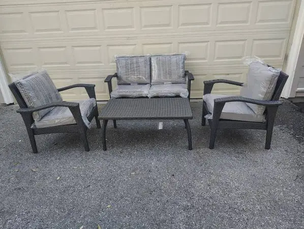 Outdoor patio wicker loveseat with chairs and coffee table