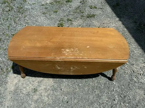 Coffee table with fold out sides 48 long 16 tall 20 wide