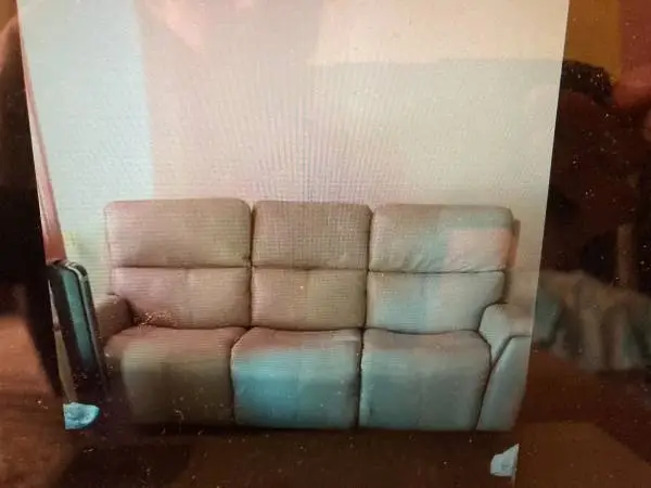 Leather power reclining sofa and reclining love seat