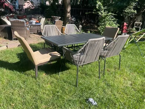Black steel patio table and 6 chairs
