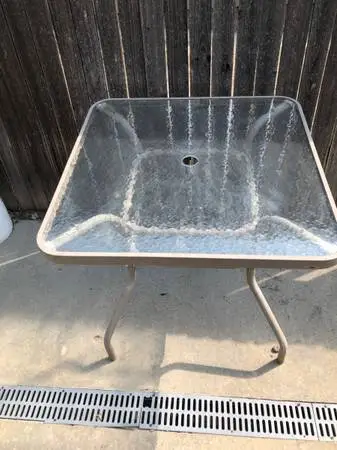 Outside table with place for umbrella