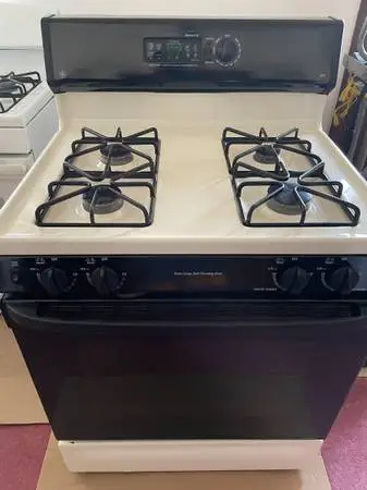 #### GE BLACK n ALMOND STOVE WITH SELF CLEANING ##