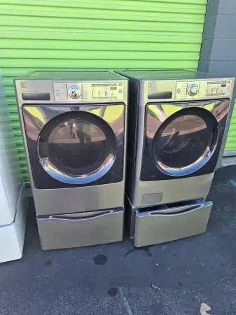 Kenmore washer and dryer set on pedestals