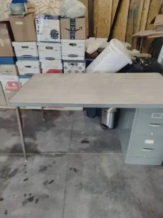 Workbench or Desk with file cabinet / storage cabinet.
