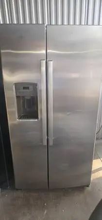 Ge stainless side by side refrigerator with ice and water