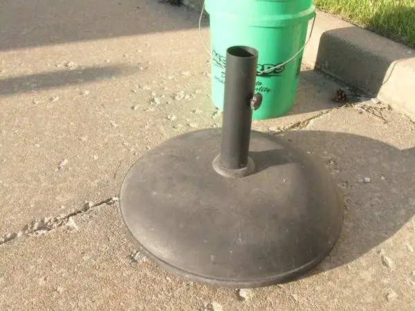 MAKING ROOM:  Patio table umbrella stand; HEAVY 55 lbs, CAN DELIVER