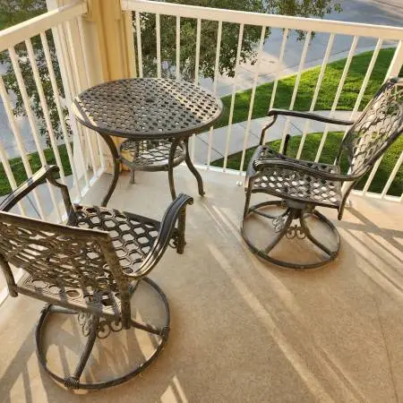 patio set with two swivel chairs