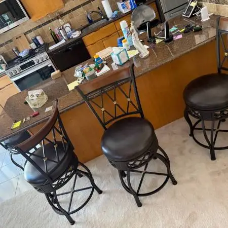 Four bar stools 26” high seats black metal high back