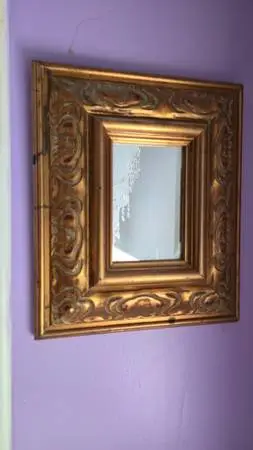 Small ornate gold mirror