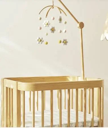 Nestig crib mobile attachment arm