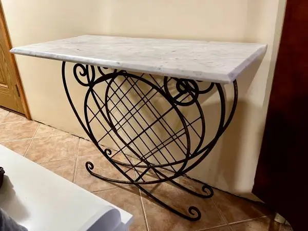 Vintage wrought iron wine rack with marble top