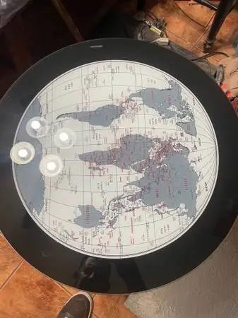 New 21 1/2 wide. Round glass top Studio 55D World Map Modern