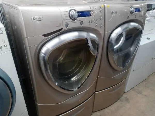 🌲GE Profile tan front load washer and dryer set on pedestals