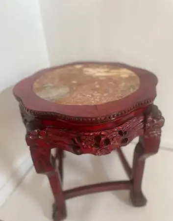 Asian inspired marble top ornately carved rosewood table