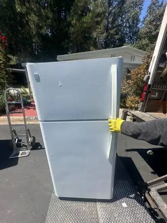 Clean white refrigerator will deliver