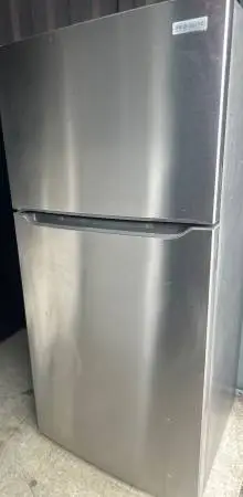 Stainless Steel Refrigerator and Flattop Stove
