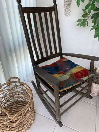 Beautiful wood rocking chair with cushion