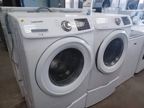 Samsung White Front Load Washer/Electric Dryer Set On Pedestals