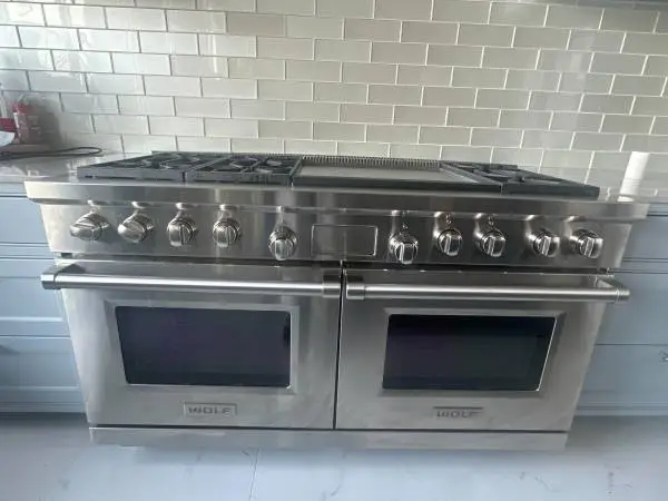 WOLF 60 INCH PRO DUAL FUEL GAS RANGE STAINLESS , LIKE NEW CONDITION