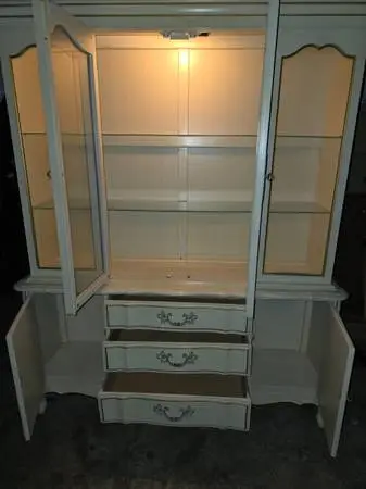 Cabinet with glass front and wood doors and shelves