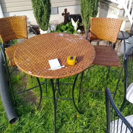 Table with 2 chairs, metal frame, wicker seat and table top, $35